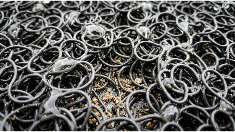 Macro Close Up of Water Droplets on PVC Coil Mat Texture