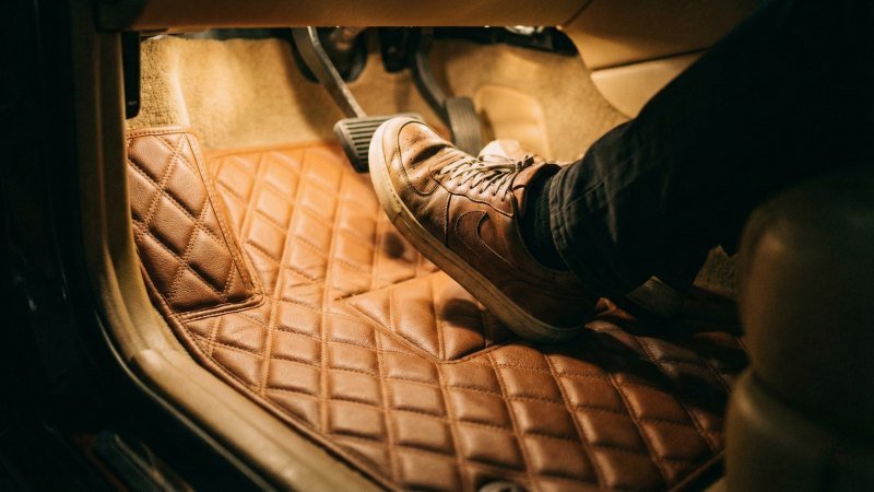 Driver Foot Resting On Soft Quilted Car Mat