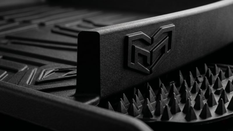 Close up texture details of premium compression molded 3D car mat with deep anti slip patterns