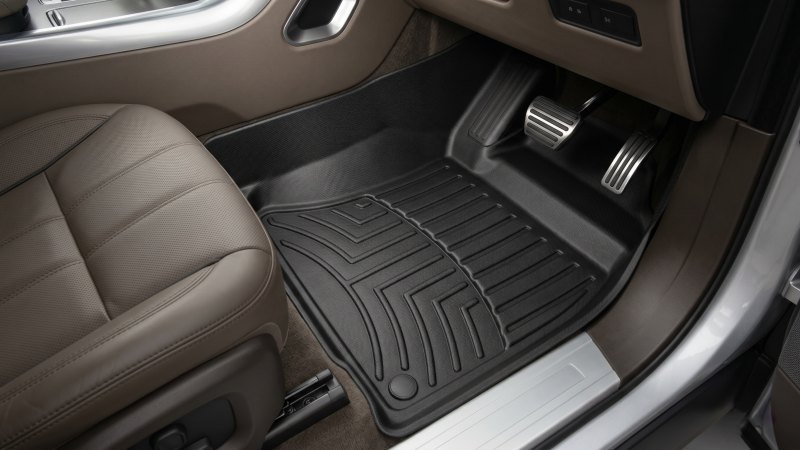 Luxury car interior floor with perfectly fitted all weather custom TPE floor mats